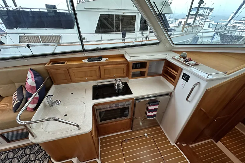 Slide: The Image of 2010 Back Cove 37 cruising on a serene lake at sunset. - 20