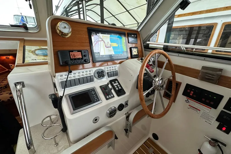 Slide: The Image of 2010 Back Cove 37 yacht cruising on open water at sunset. - 22