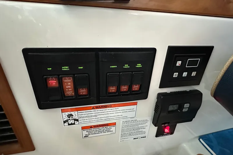 Slide: The Image of Back Cove 37 boat cruising on calm waters with mountain backdrop, 2010 model. - 25