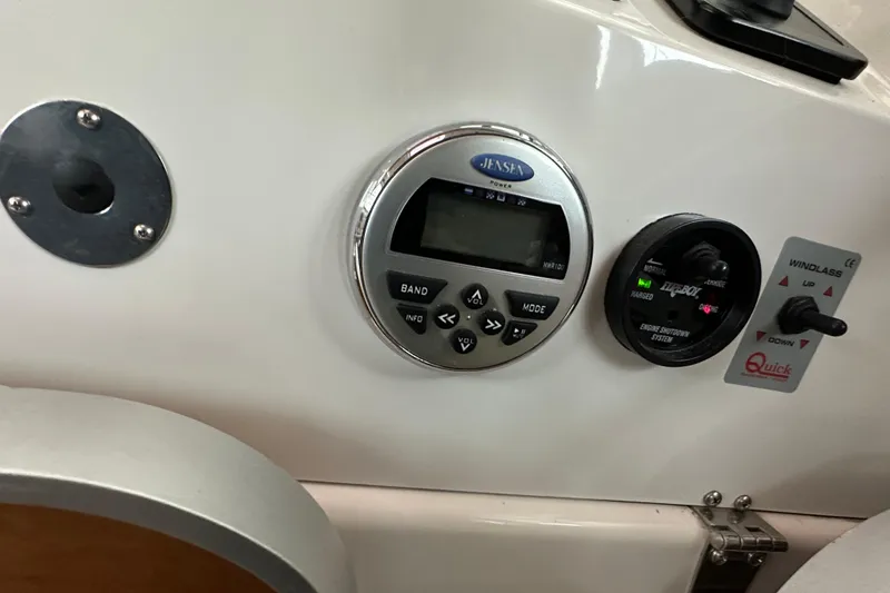 Slide: The Image of 2010 Back Cove 37 yacht interior with open glass doors, overlooking serene waters. - 27