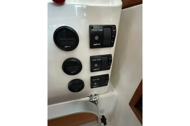 Slide: The Image of 2010 Back Cove 37 boat with striped seating, American flag, and ocean view. - 28