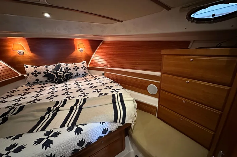 Slide: The Image of Interior of 2010 Back Cove 37 yacht with beige seating and star-patterned pillow. - 31