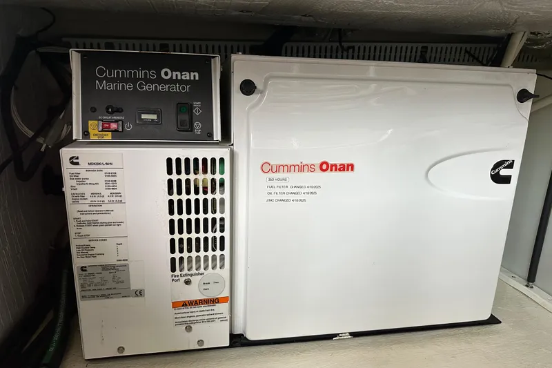 Slide: The Image of Control panel of a 2010 Back Cove 37 boat with various switches and dials. - 43