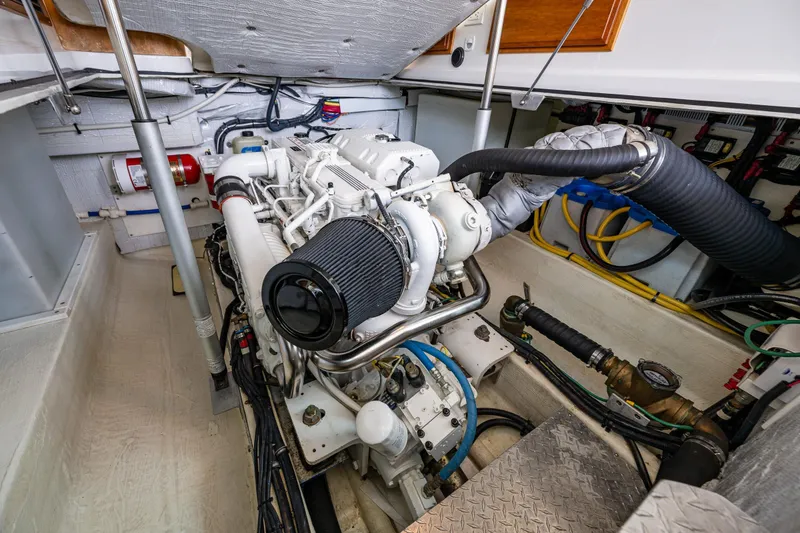 Slide: The Image of Engine room of 2010 Back Cove 37 boat, showcasing detailed mechanical components. - 58
