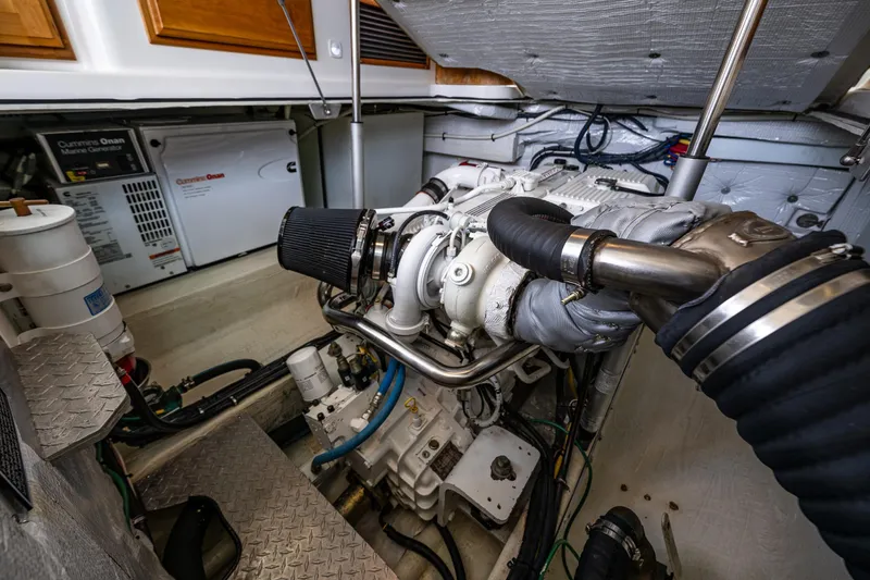 Slide: The Image of Engine room of a 2010 Back Cove 37 boat with Cummins Onan generator. - 60