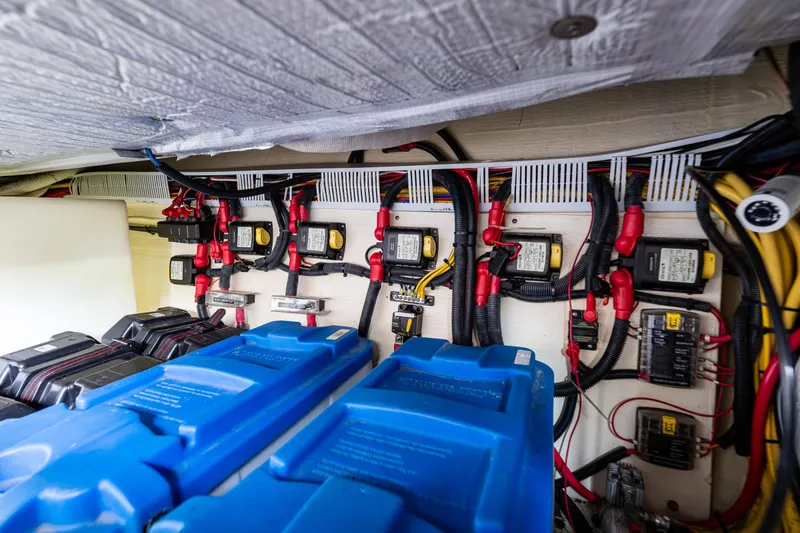 Slide: The Image of Electrical system of a 2010 Back Cove 37 boat, featuring batteries and wiring. - 65