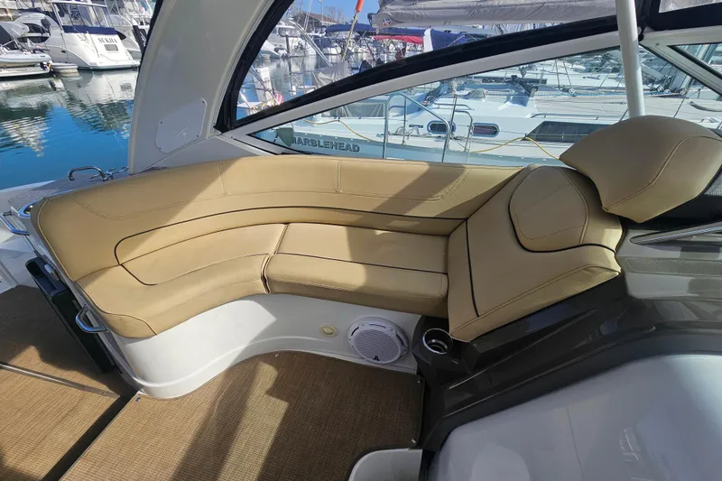 Slide: The Image of Luxurious seating area on 2012 Cruisers Yachts 350 Express, docked at marina. - 18