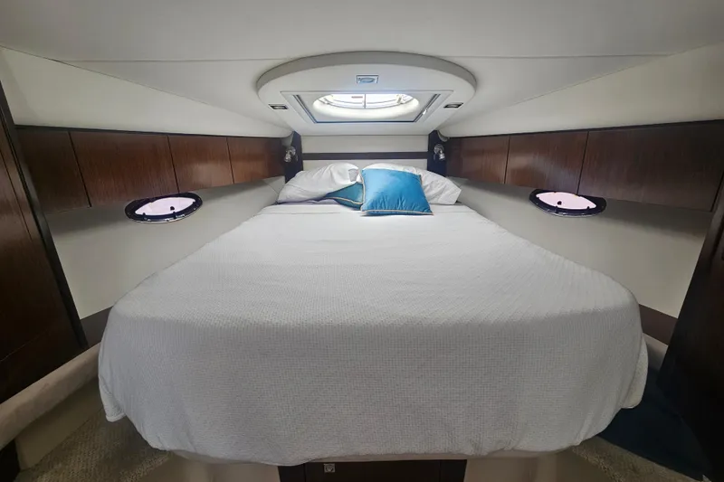 Slide: The Image of Luxurious cabin interior of 2012 Cruisers Yachts 350 Express with cozy bedding. - 21
