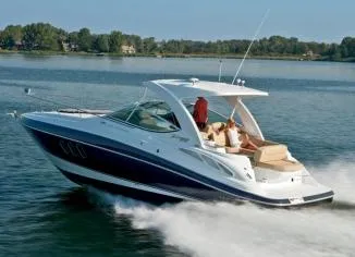 Slide: The Image of Manufacturer Provided Image: 2012 Cruisers Yachts 350 Express cruising on a lake. - 3