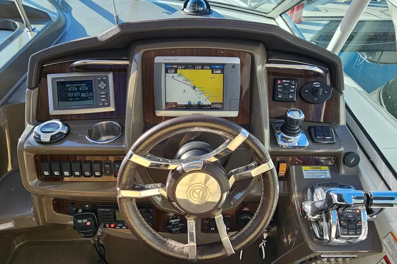Slide: The Image of Cockpit of 2012 Cruisers Yachts 350 Express with navigation and control systems. - 9