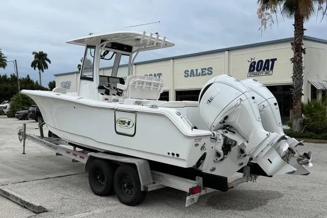 The Image of 2025 Sea Hunt Ultra 265 SE boat on trailer at dealership. - 0