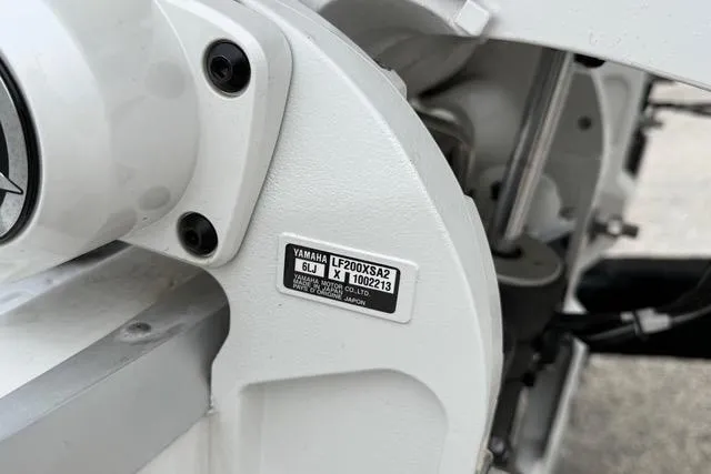 Slide: The Image of Close-up of Yamaha LF200XSA2 engine part on 2025 Sea Hunt Ultra 265 SE boat. - 10