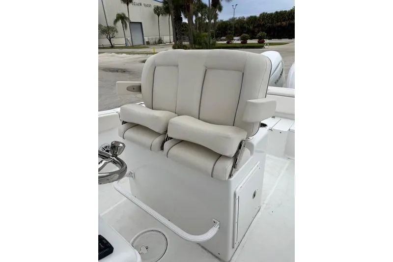 Slide: The Image of Luxury seating on 2025 Sea Hunt Ultra 265 SE boat, featuring plush white upholstery. - 14