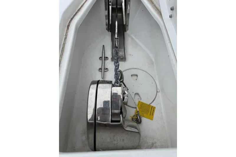 Slide: The Image of Anchor compartment of 2025 Sea Hunt Ultra 265 SE boat, featuring chain and cleat. - 18