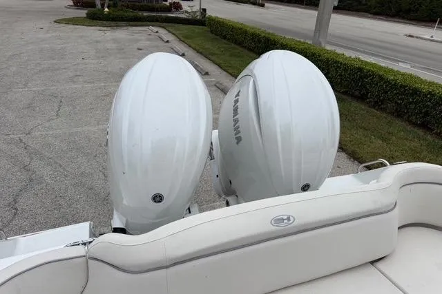 Slide: The Image of Twin Yamaha outboard engines on a 2025 Sea Hunt Ultra 265 SE boat. - 19