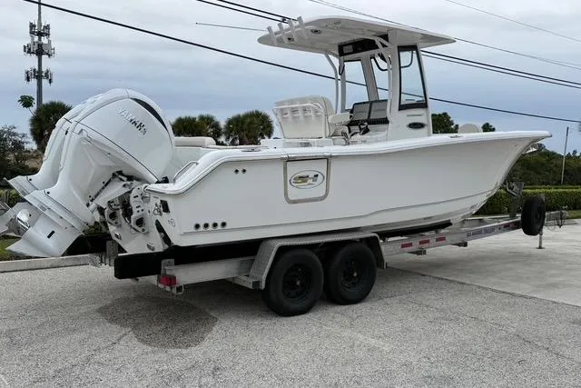 Slide: The Image of 2025 Sea Hunt Ultra 265 SE boat on trailer, featuring Yamaha outboard motor. - 2