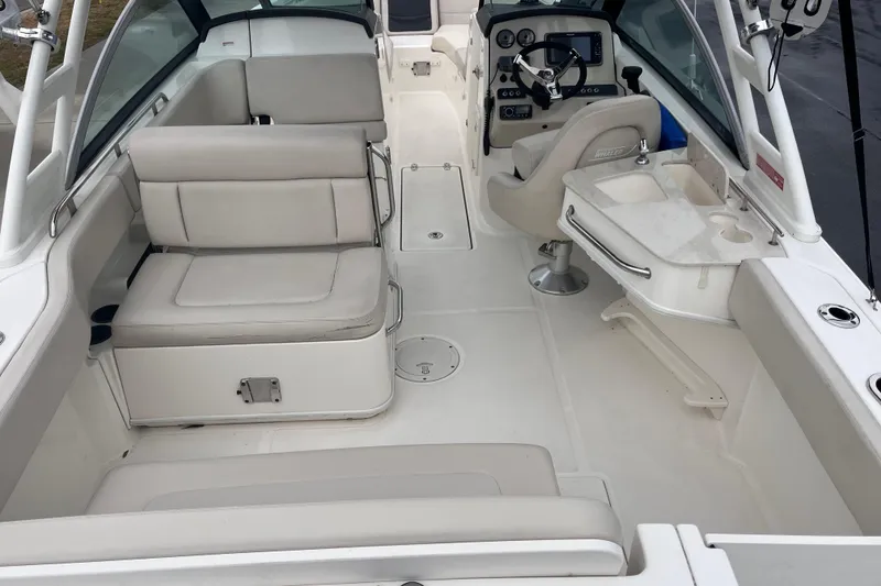 Slide: The Image of 2015 Boston Whaler 230 Vantage boat interior with seating and helm station. - 13