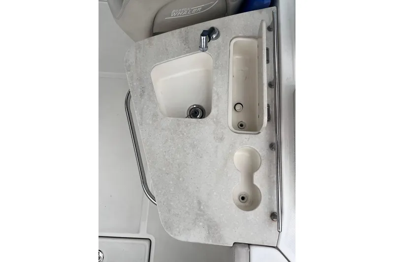 Slide: The Image of Boston Whaler 230 Vantage 2015 boat sink and countertop detail. - 15