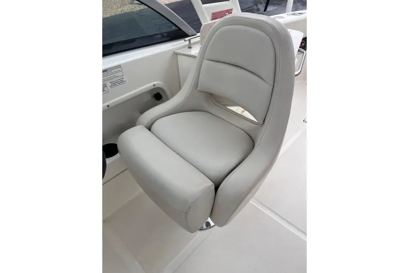 Slide: The Image of Comfortable seating on 2015 Boston Whaler 230 Vantage boat, featuring sleek design and premium materials. - 19