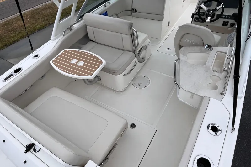 Slide: The Image of 2015 Boston Whaler 230 Vantage boat interior with seating and table. - 29