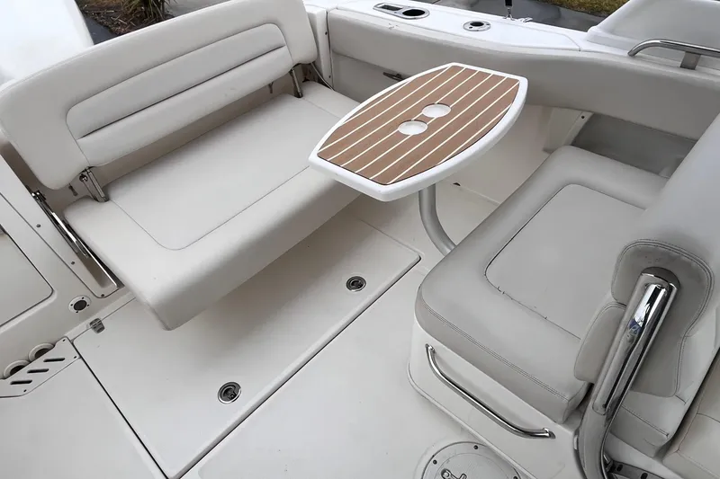 Slide: The Image of 2015 Boston Whaler 230 Vantage interior with seating and table. - 30