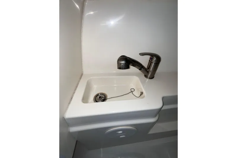 Slide: The Image of Compact sink with faucet in 2015 Boston Whaler 230 Vantage boat. - 32