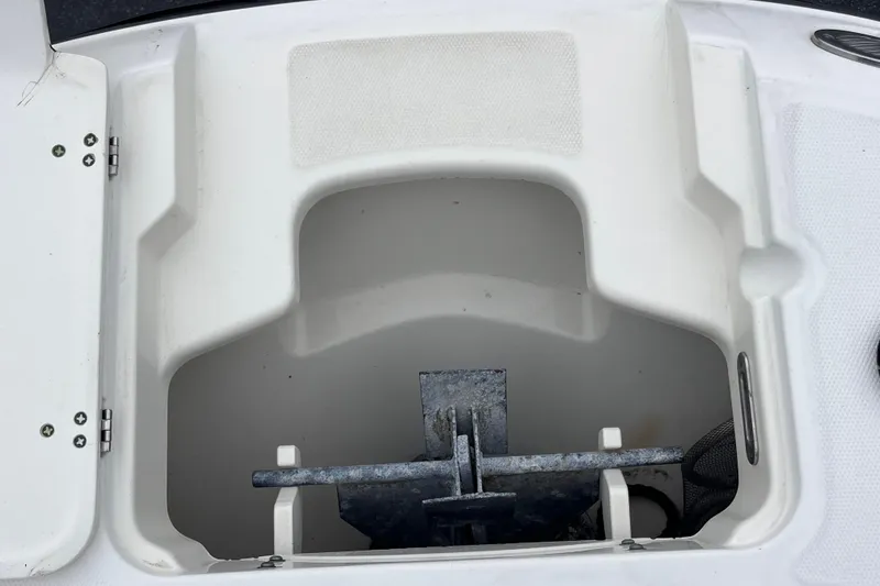 Slide: The Image of Anchor storage compartment on a 2015 Boston Whaler 230 Vantage boat. - 34