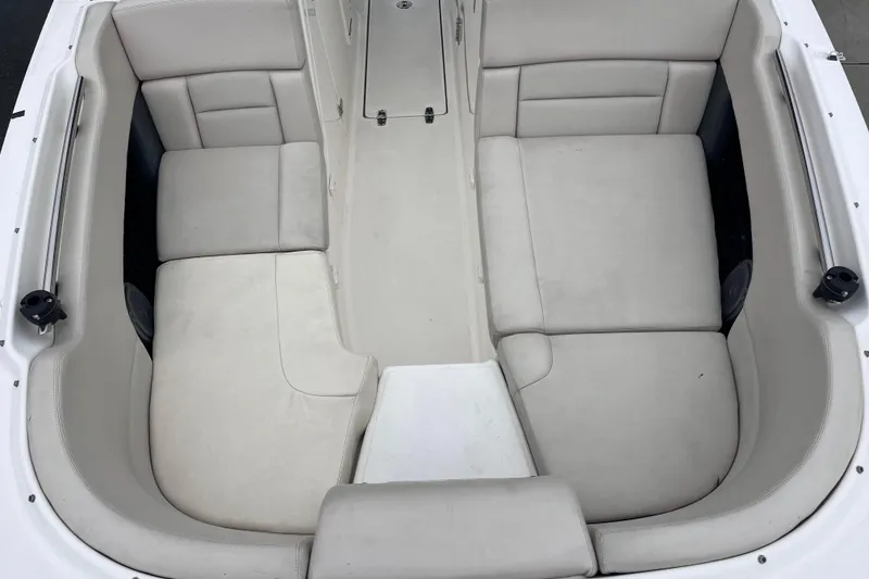 Slide: The Image of 2015 Boston Whaler 230 Vantage boat interior with spacious seating and light upholstery. - 35