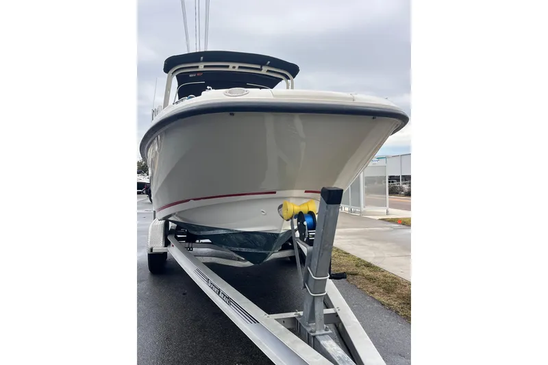 Slide: The Image of 2015 Boston Whaler 230 Vantage boat on trailer, front view, overcast day. - 5