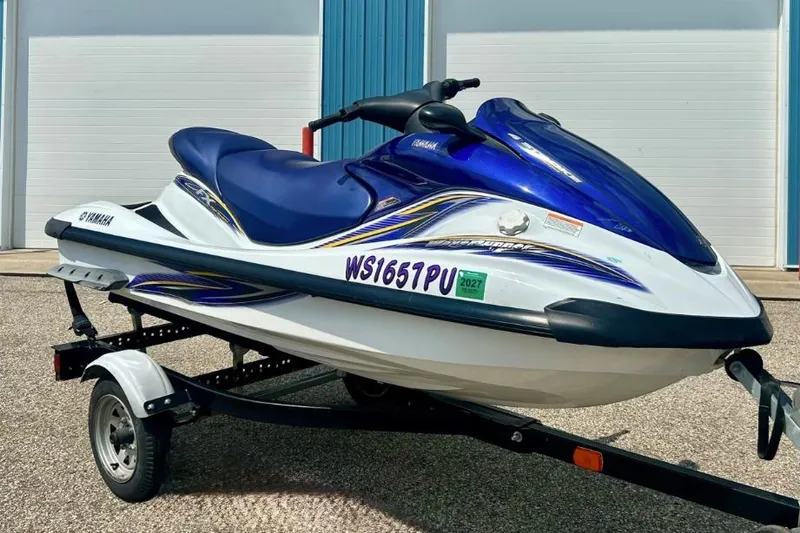 The Image of 2004 Yamaha FX 1000 jet ski in blue and white on a trailer. - 0