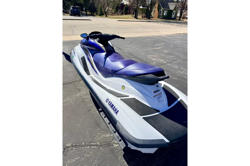 Slide: The Image of 2004 Yamaha WaveRunner FX Cruiser jet ski parked on pavement. - 12