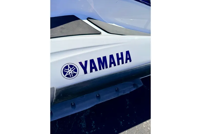 Slide: The Image of Close-up of 2004 Yamaha WaveRunner FX Cruiser logo on white body. - 13