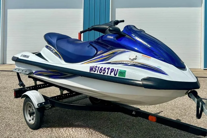 Slide: The Image of 2004 Yamaha FX 1000 jet ski on trailer, blue and white design. - 4