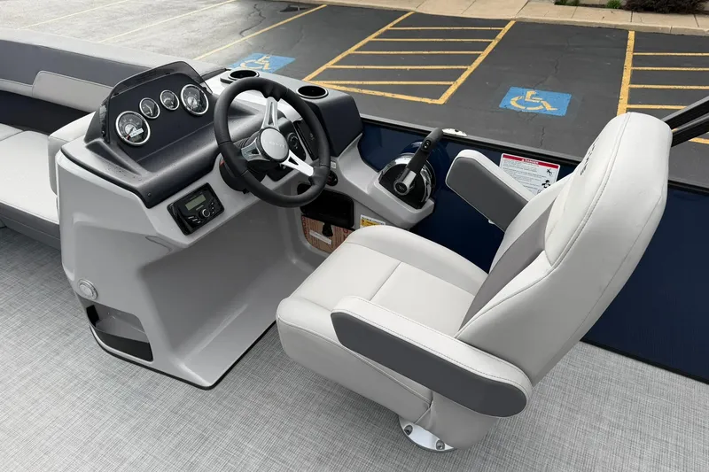 Slide: The Image of Steering console of 2026 Lowe LS 190 boat with modern controls and comfortable seating. - 11