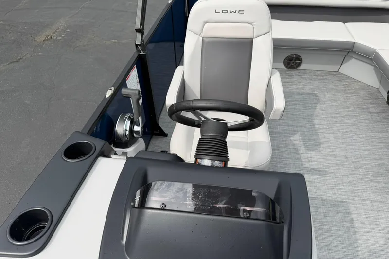 Slide: The Image of Steering console of 2026 Lowe LS 190 boat with comfortable seating. - 12