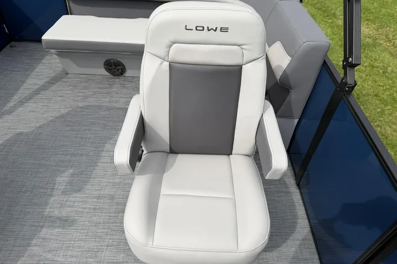 Slide: The Image of Luxurious 2026 Lowe LS 190 boat seat with armrests on a sleek deck. - 13