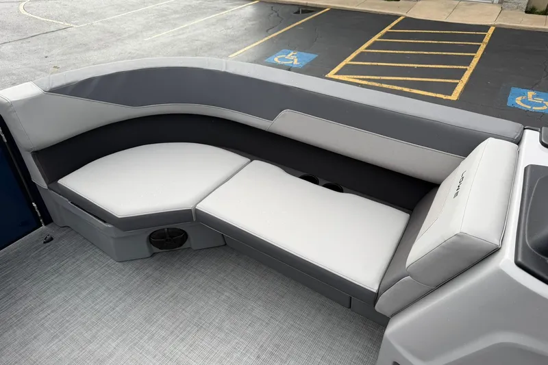 Slide: The Image of 2026 Lowe LS 190 boat interior with gray cushioned seating and modern design. - 15