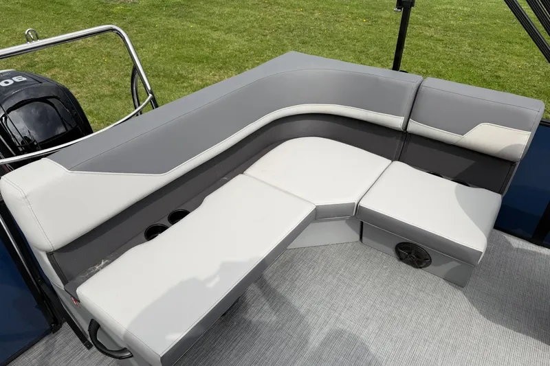 Slide: The Image of 2026 Lowe LS 190 boat interior with gray seating and cup holders. - 16