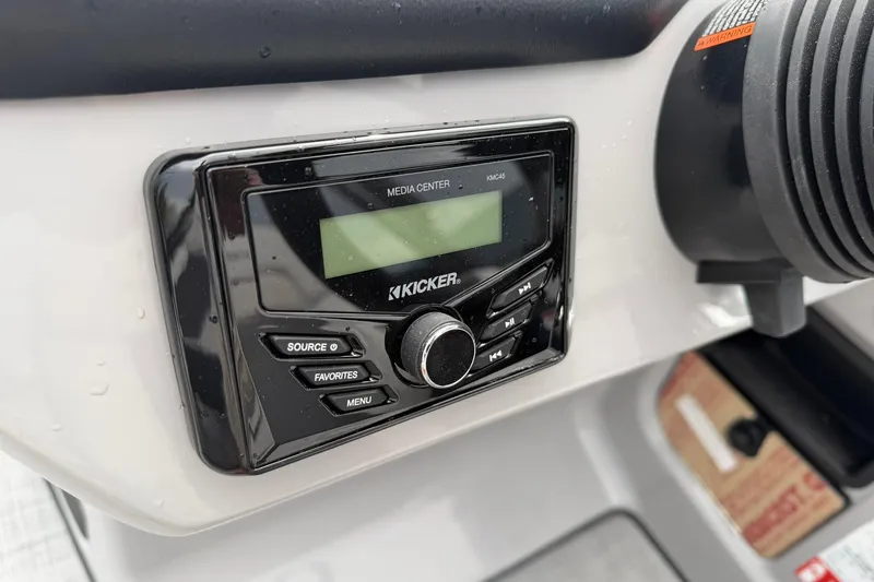 Slide: The Image of Kicker media center in 2026 Lowe LS 190 boat dashboard, featuring control buttons. - 17
