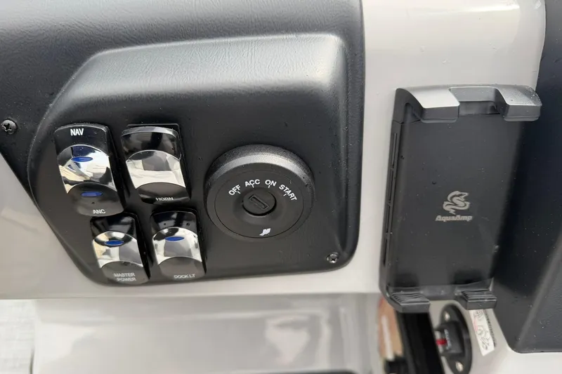Slide: The Image of Control panel of a 2026 Lowe LS 190 boat with switches and ignition. - 19