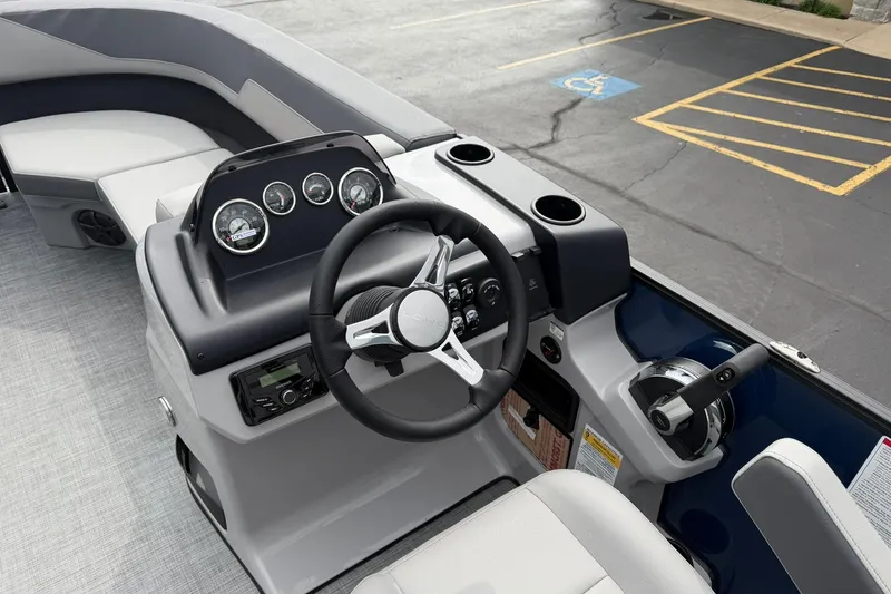Slide: The Image of Steering console of 2026 Lowe LS 190 boat with modern controls and gauges. - 9