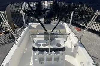 Slide: The Image of 2022 Boston Whaler 170 Montauk boat interior with console and seating. - 10