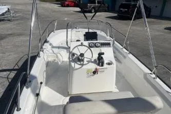 Slide: The Image of 2022 Boston Whaler 170 Montauk boat interior with steering console and seating. - 8