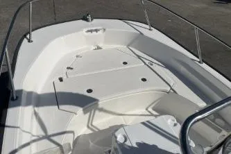 Slide: The Image of 2022 Boston Whaler 170 Montauk boat deck with seating and railings. - 9