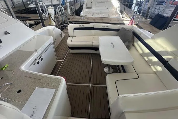 Slide: The Image of Luxurious 2010 Sea Ray 450 Sundancer yacht interior with seating and table. - 14