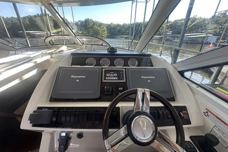 Slide: The Image of Cockpit of 2010 Sea Ray 450 Sundancer with Raymarine navigation system. - 17