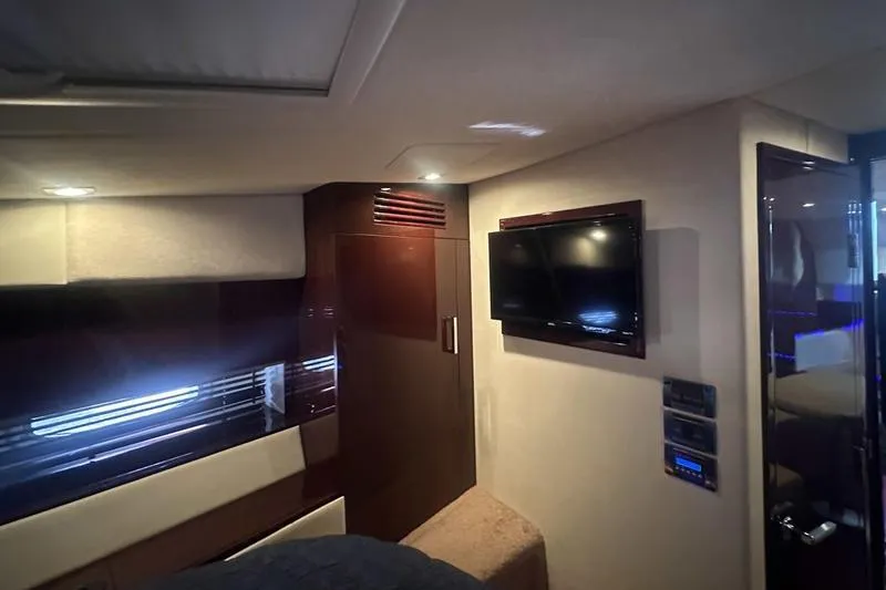 Slide: The Image of Interior of 2010 Sea Ray 450 Sundancer yacht with TV and modern furnishings. - 27