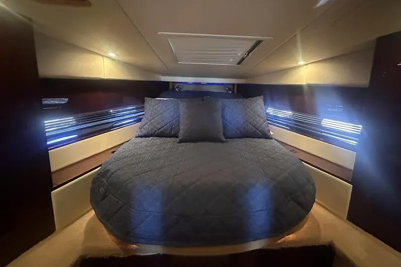 Slide: The Image of Luxurious cabin interior of 2010 Sea Ray 450 Sundancer yacht with cozy bedding. - 31