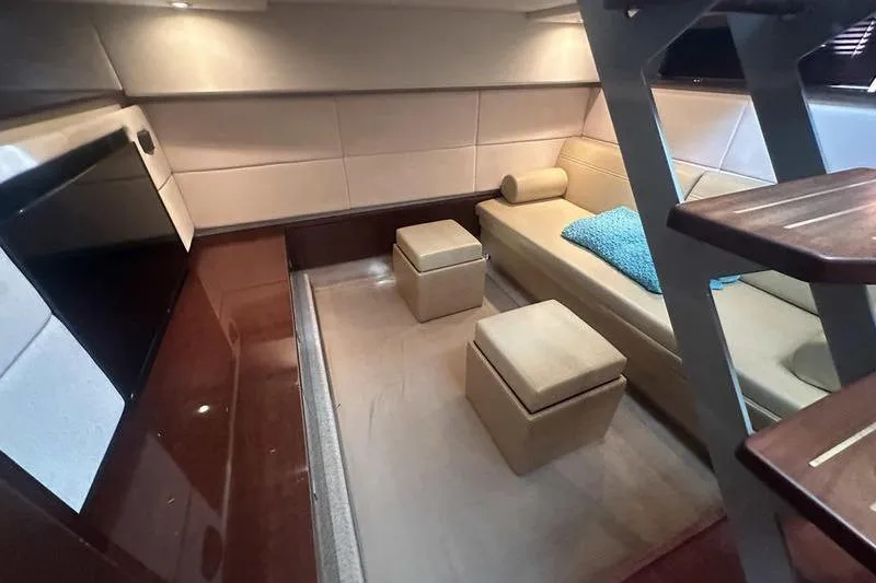 Slide: The Image of Luxurious interior of 2010 Sea Ray 450 Sundancer yacht with modern seating and decor. - 33