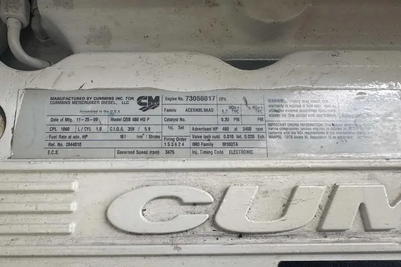 Slide: The Image of Cummins engine label on 2010 Sea Ray 450 Sundancer, detailing specifications and serial number. - 39